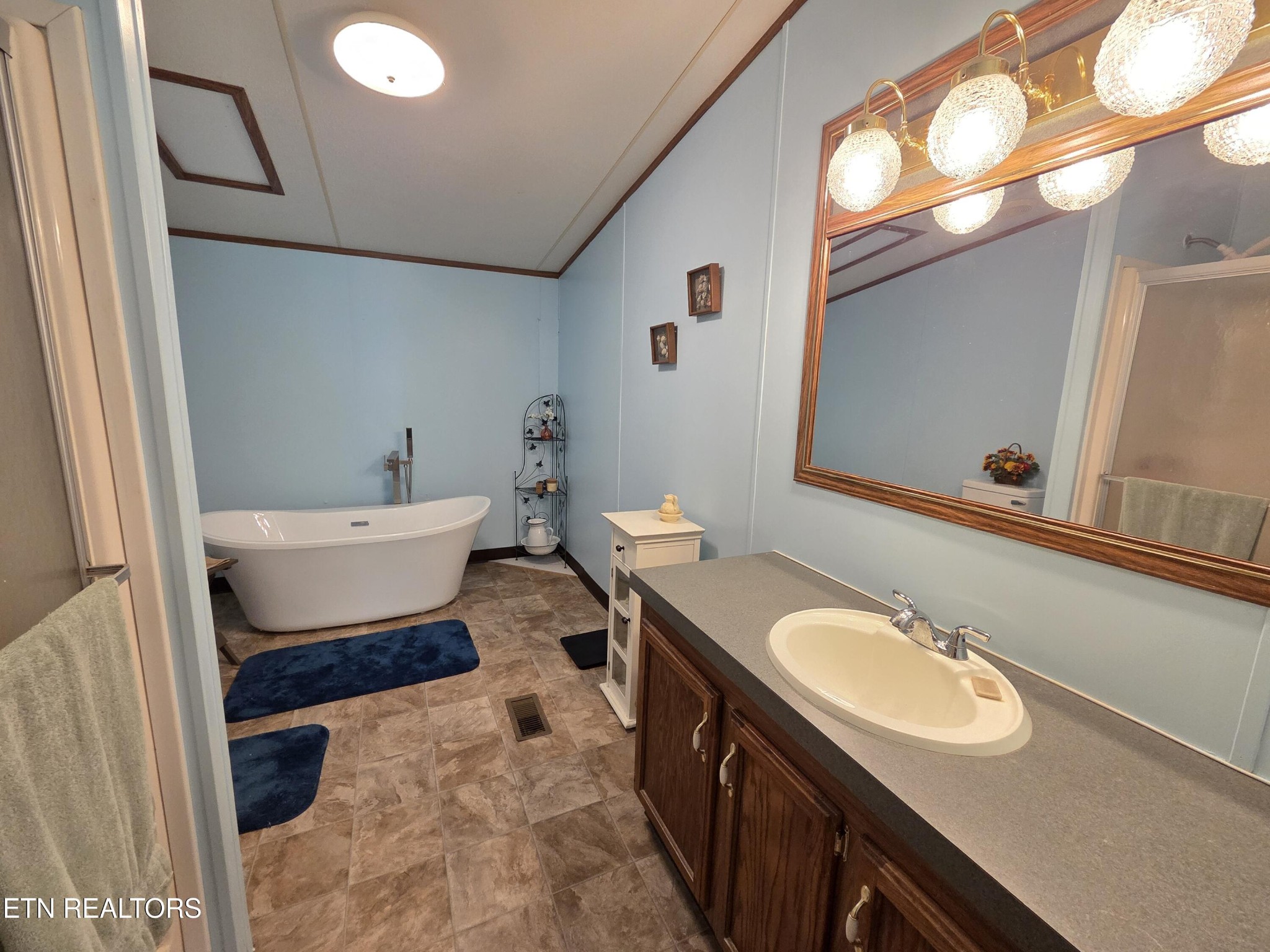 149 Carter Town Road Crossville, TN 38571 - Photo 16 of 30 a bathroom with a sink and a mirror