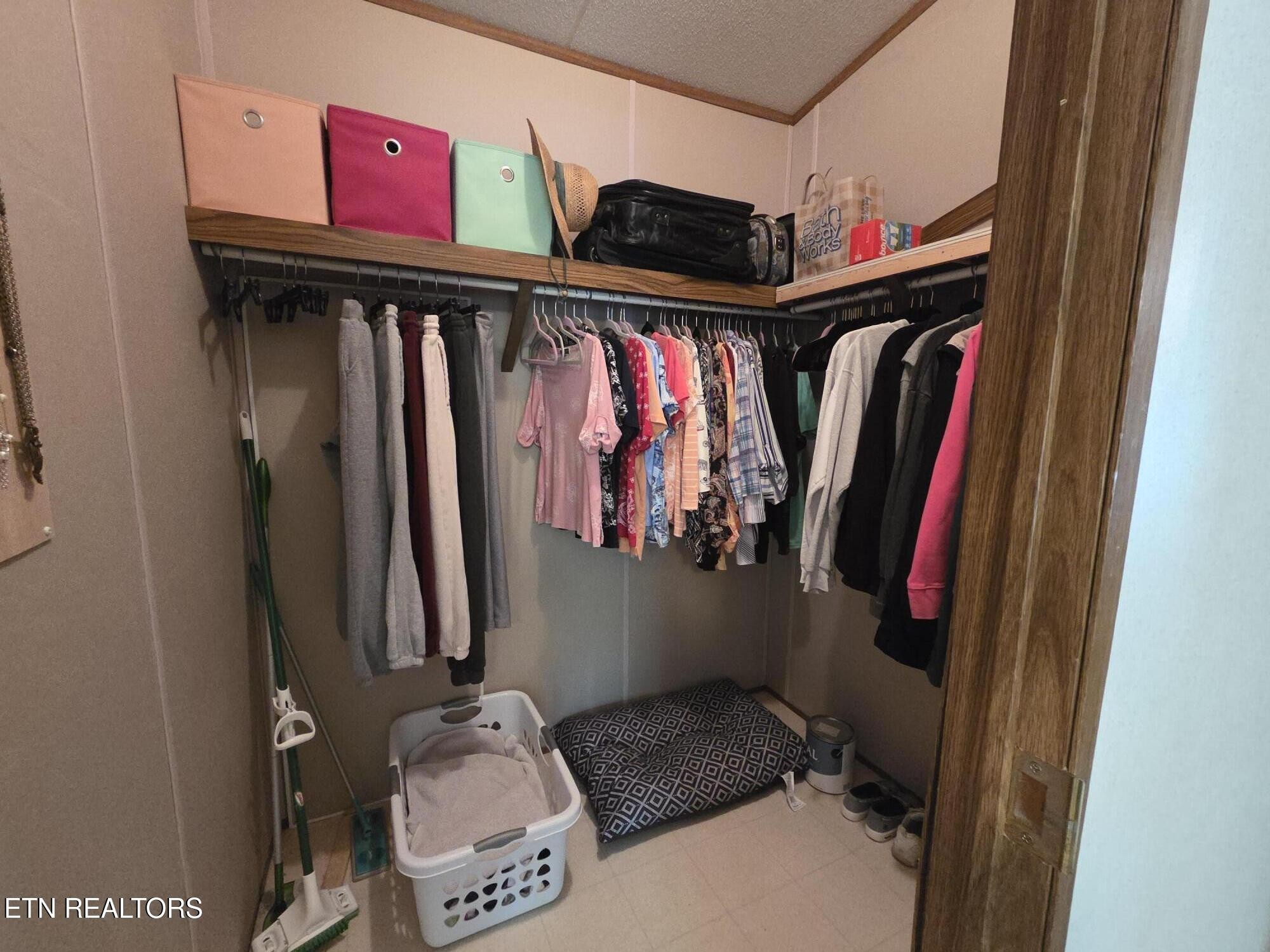 149 Carter Town Road Crossville, TN 38571 - Photo 23 of 30 a view of walk in closet with clothes