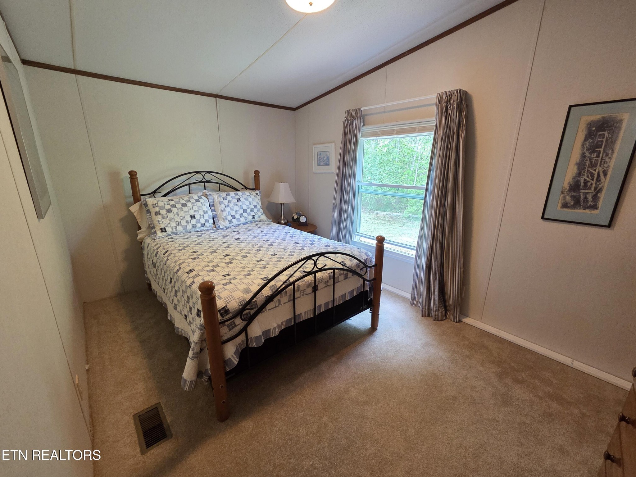 149 Carter Town Road Crossville, TN 38571 - Photo 28 of 30 a bed sitting in a bedroom next to a window