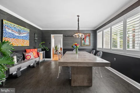 a kitchen with stainless steel appliances granite countertop wooden cabinets a sink and a stove