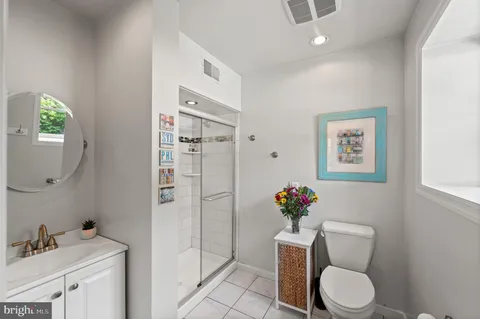 a bedroom with a bed a desk and chair