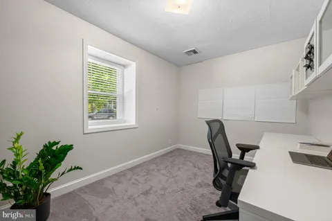 a bathroom with a bathtub and window