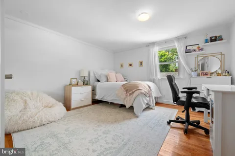 a patio with a table and chairs under an umbrella