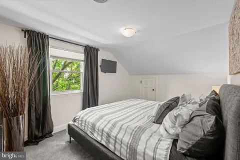 an outdoor space with furniture and umbrella