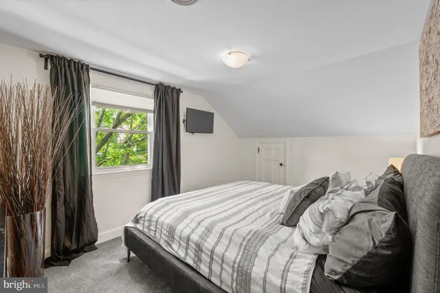 an outdoor space with furniture and umbrella