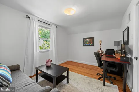 a view of a house with backyard sitting area and swimming pool