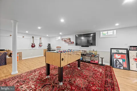 an aerial view of a house with garden space and street view