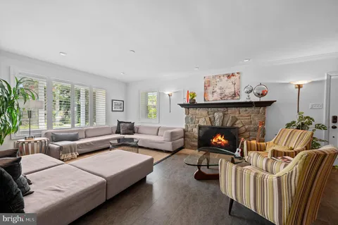 a view of a dining room with furniture wooden floor and chandelier