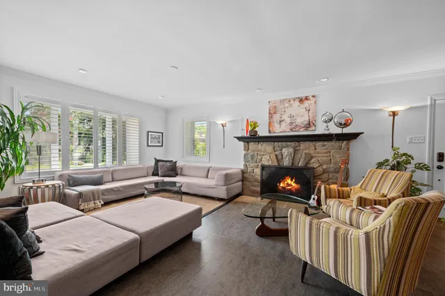 a view of a dining room with furniture wooden floor and chandelier