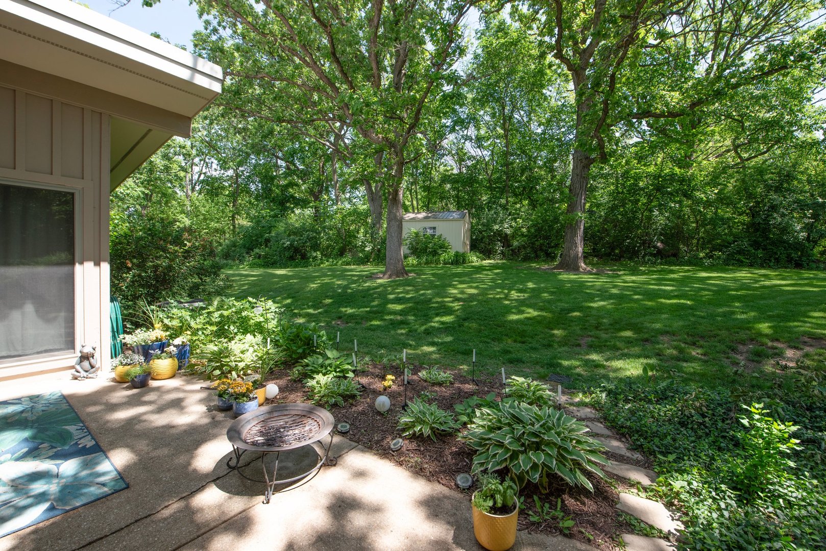 1196 Nottingham Lane Elgin, IL 60120 - Photo 42 of 45 a backyard of a house with lots of green space
