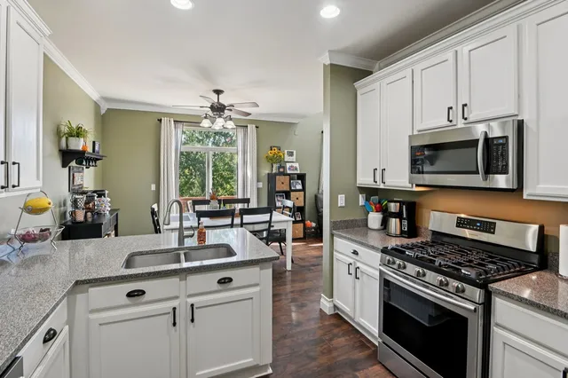 a kitchen with a stove and a sink