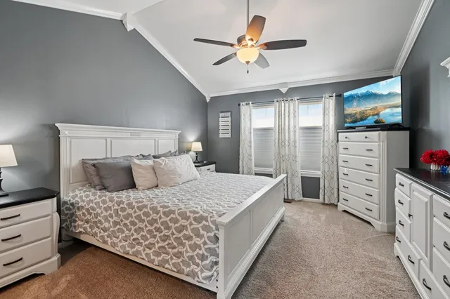a bedroom with a bed and a dresser
