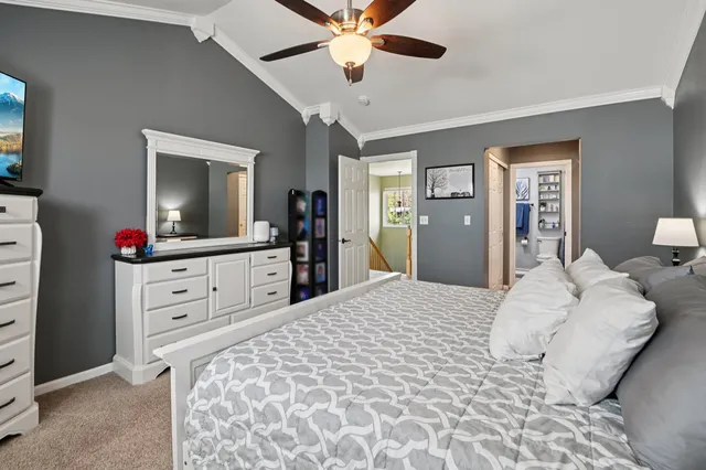 a bedroom with a bed and a dresser