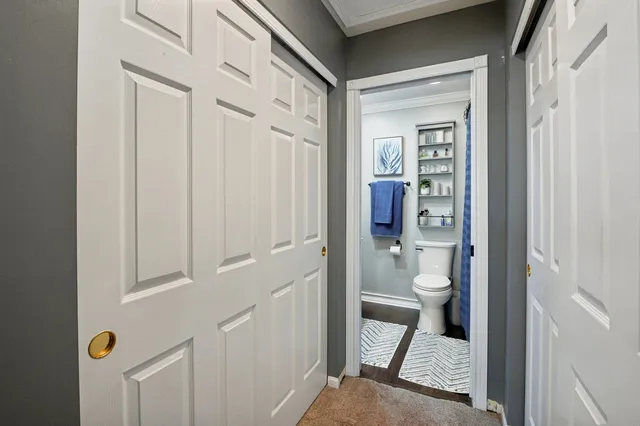 a view of a bathroom from a hallway