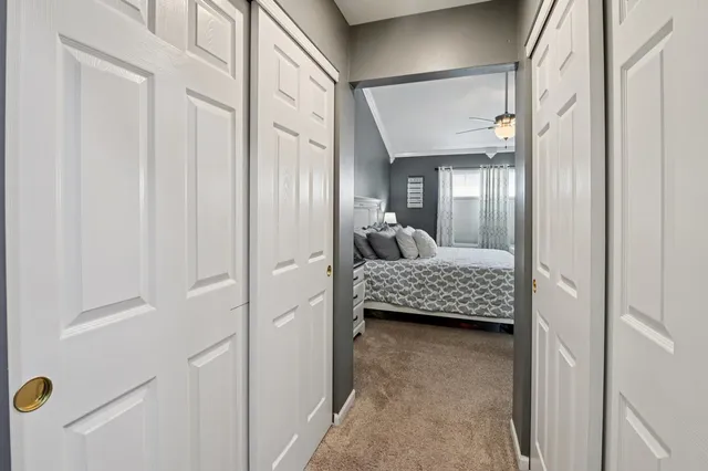 a bedroom with a bed and a mirror