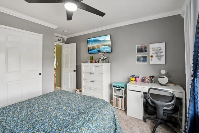 a bedroom with a workspace