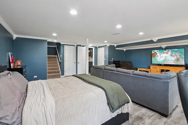 a bed room with a bed and a television