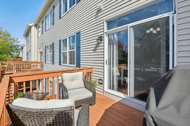 a view of a chair and table in the balcony