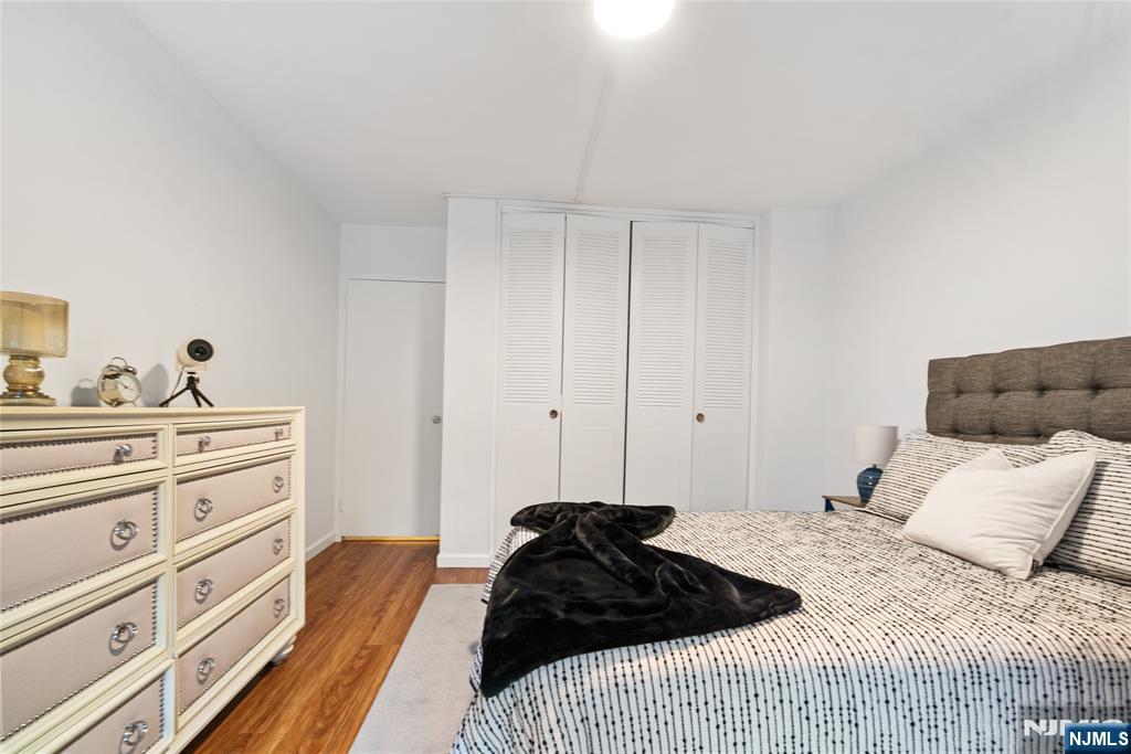 301 Beech Street, Unit 2B Hackensack, NJ 07601 - Photo 15 of 21 a bedroom with a bed and a couch