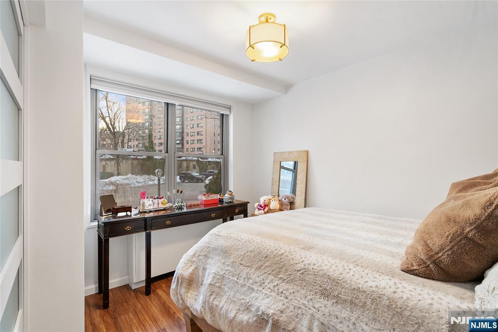 301 Beech Street, Unit 2B Hackensack, NJ 07601 - Photo 18 of 21 a bed room with a bed and a window
