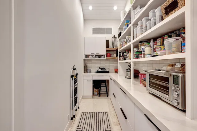 a view of a house with backyard porch and sitting area