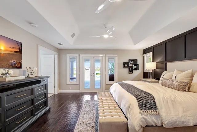 a aerial view of a house with swimming pool and lake view