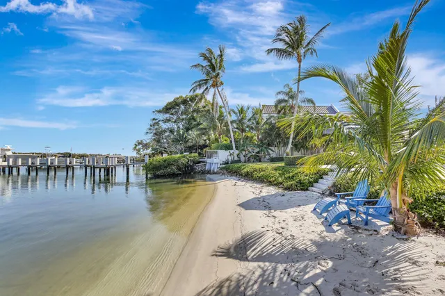 a view of swimming pool with a table and chairs