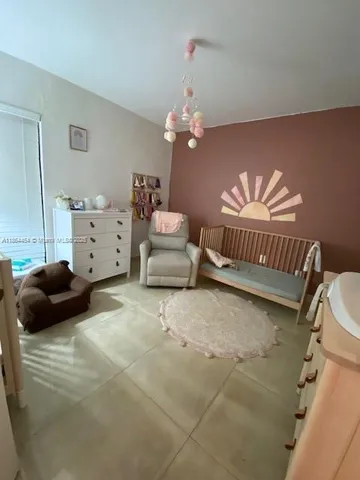 a bedroom with furniture and a couch