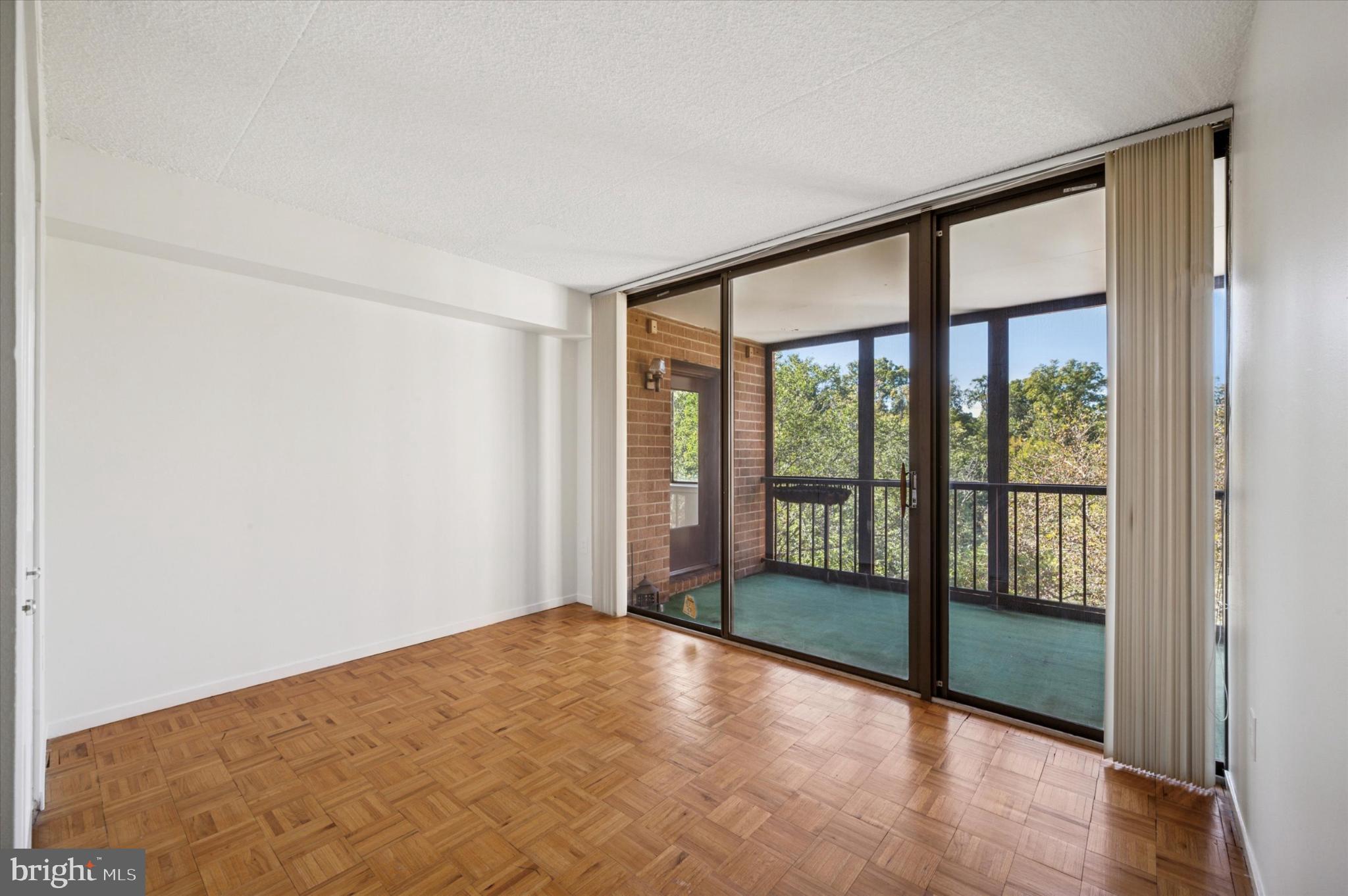 19 Rock Hill Road, Unit 7D Bala Cynwyd, PA 19004 - Photo 24 of 37 a view of an empty room with wooden floor and a window