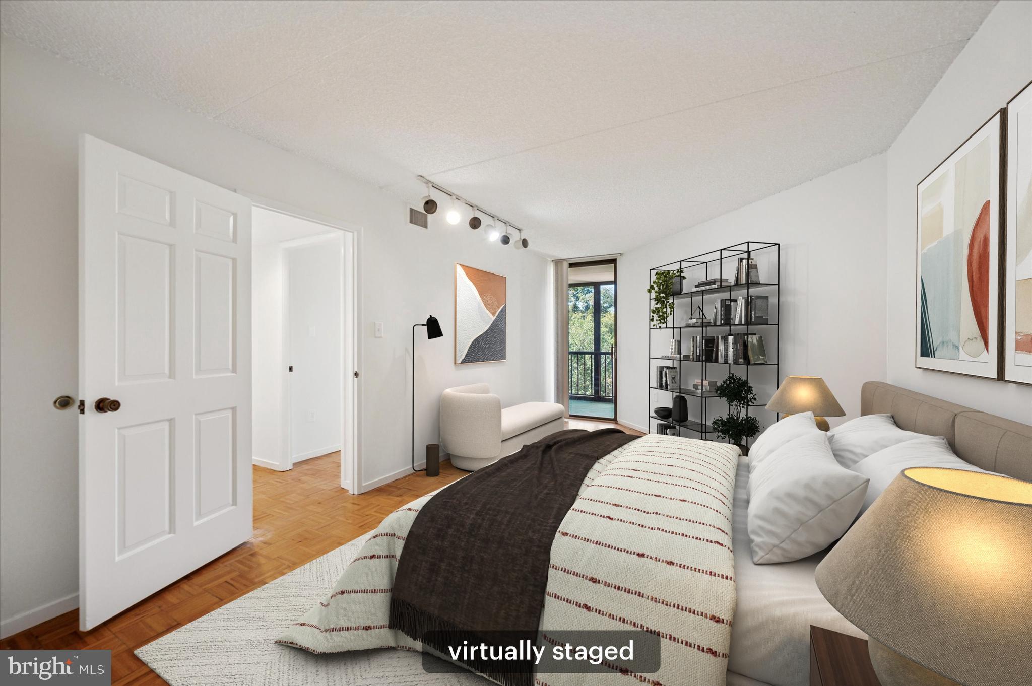 19 Rock Hill Road, Unit 7D Bala Cynwyd, PA 19004 - Photo 27 of 37 a bedroom with a bed and window