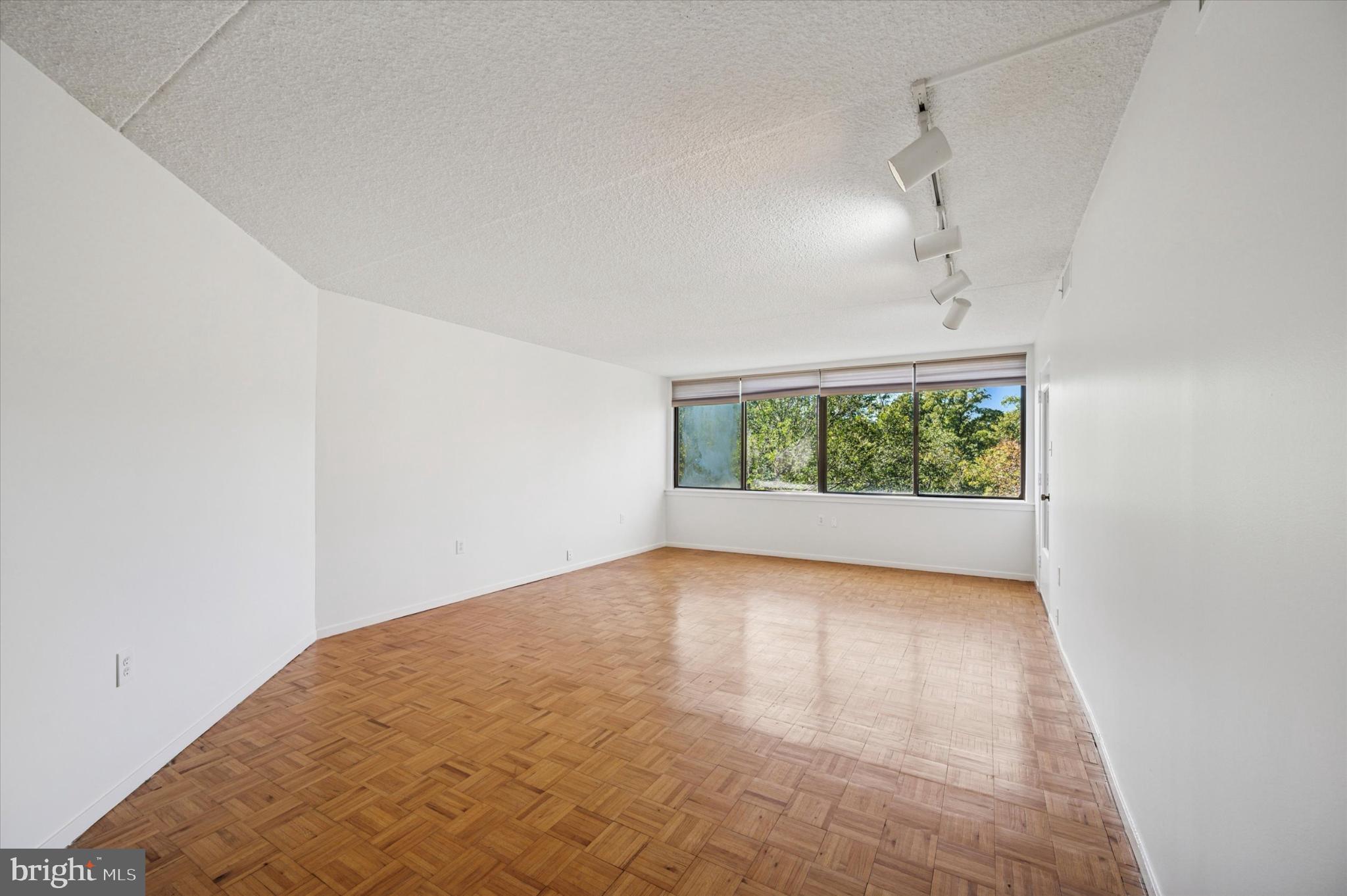 19 Rock Hill Road, Unit 7D Bala Cynwyd, PA 19004 - Photo 7 of 37 a view of a big room with wooden floor chandelier and windows
