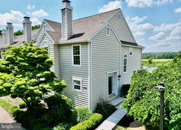 a view of a house with a flower garden