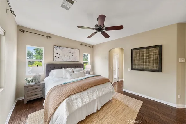a bathroom with a granite countertop sink a toilet and a mirror