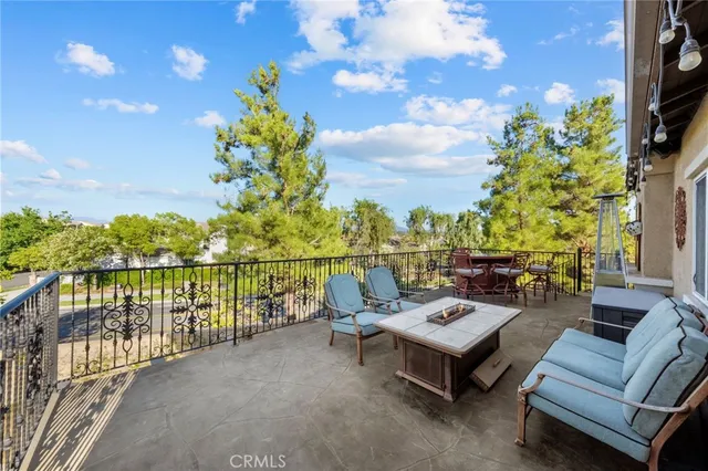 a front view of a house with a yard and potted plants