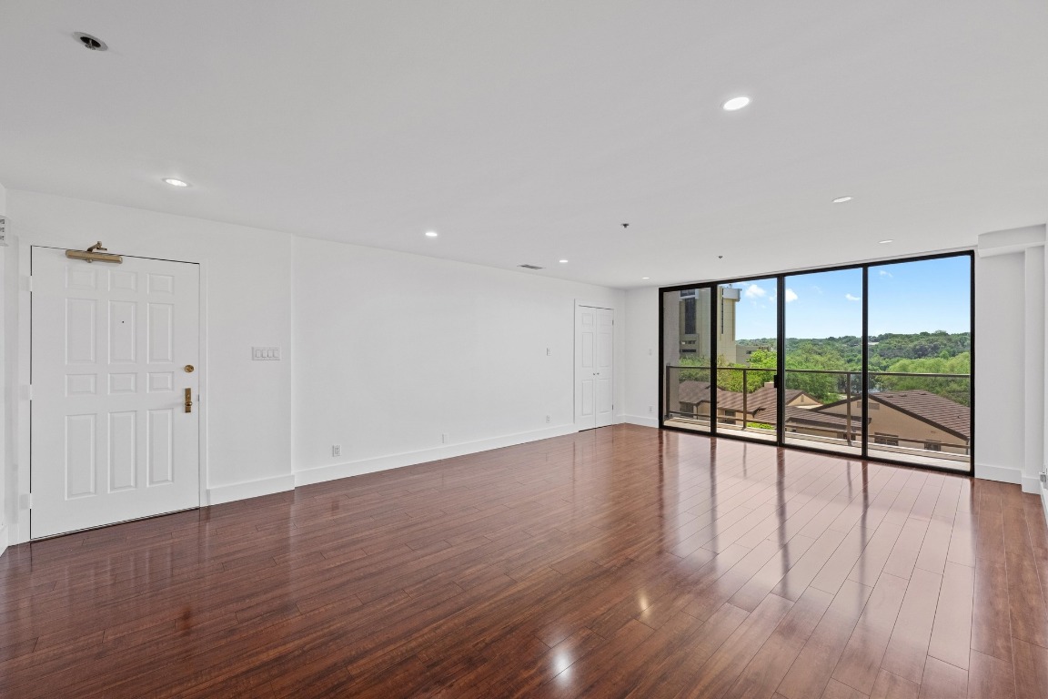 40 North Interstate Highway 35, Unit 5B3 Austin, TX 78701 - Photo 1 of 1 a view of an empty room with wooden floor and a window