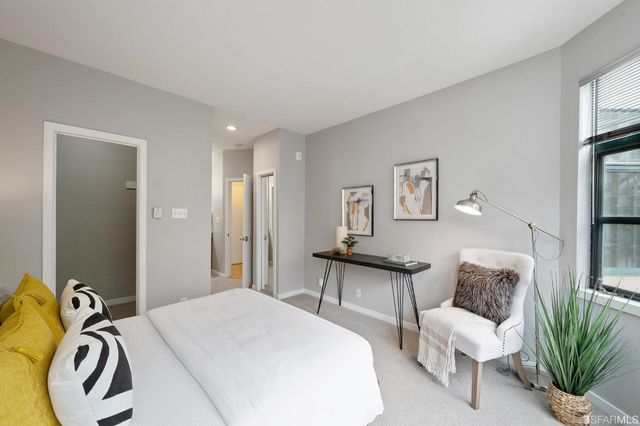 a en suite bathroom with a sink and a mirror