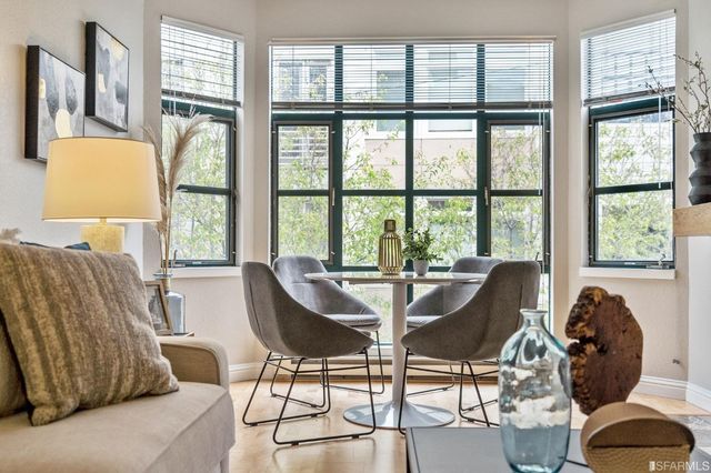 a view of a dining room with furniture window and outside view