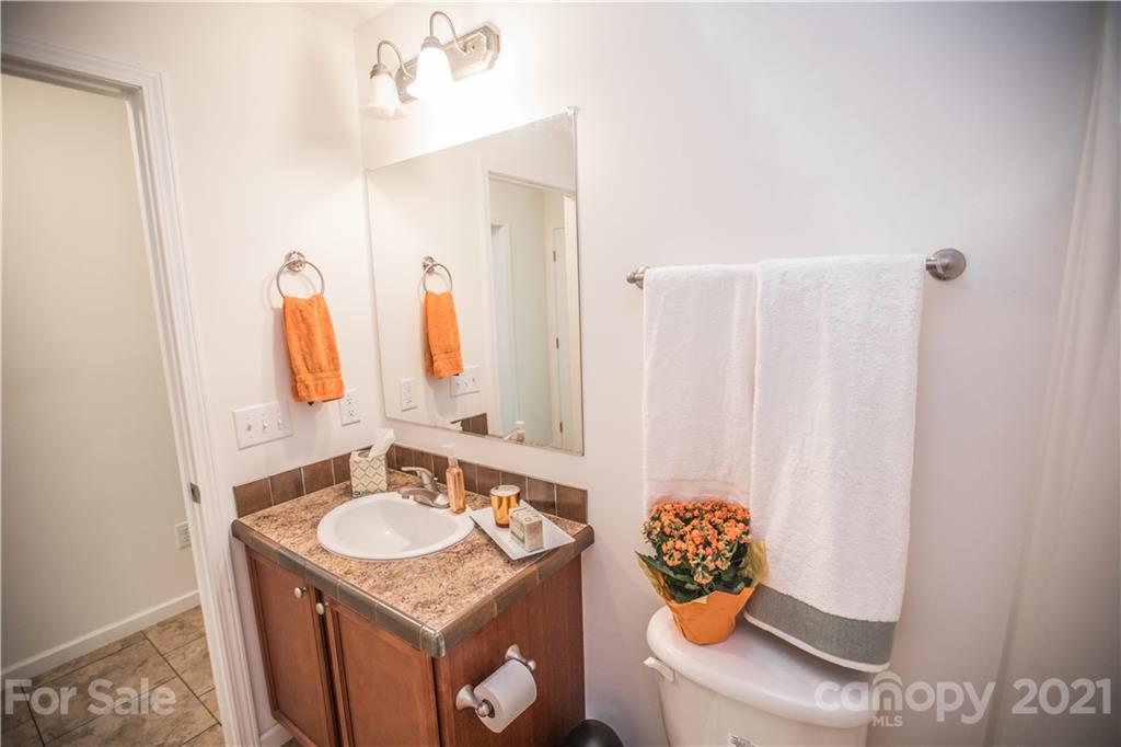 333 Hickory Street Rutherfordton, NC 28139 - Photo 22 of 22 a bathroom with a granite countertop sink and a mirror