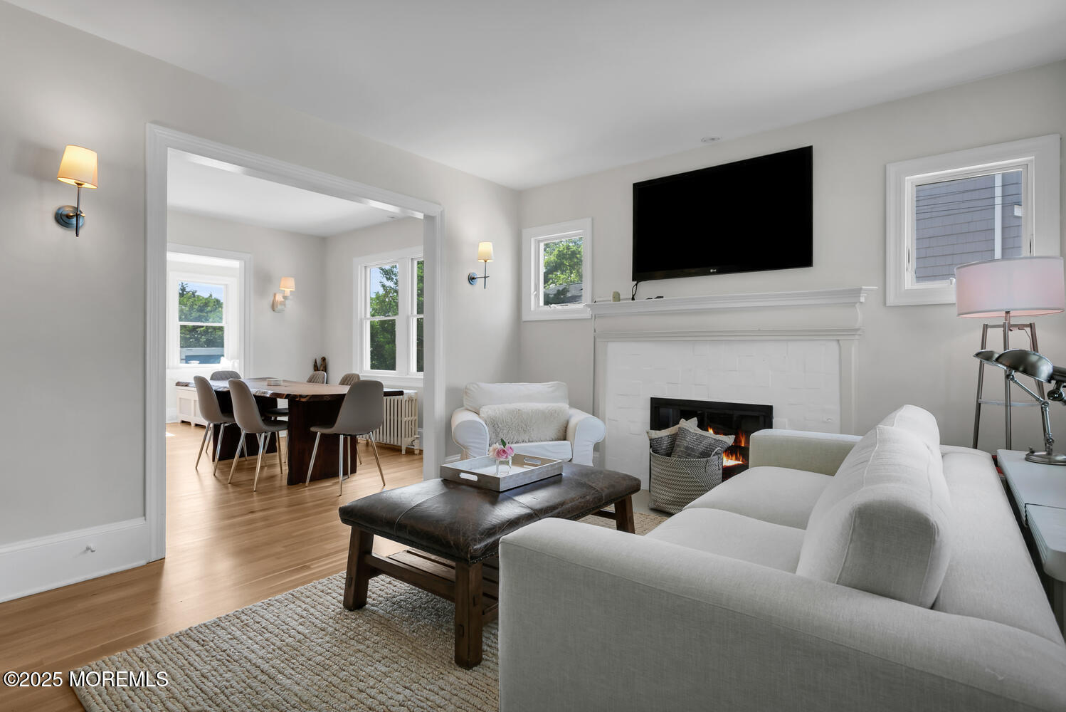 a living room with furniture fireplace and flat screen tv