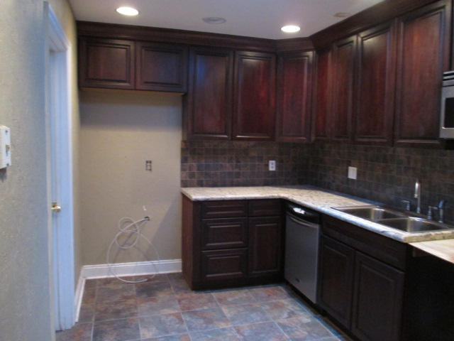 9667 Oregon Road Boca Raton, FL 33434 - Photo 5 of 20 a kitchen with a sink and cabinets
