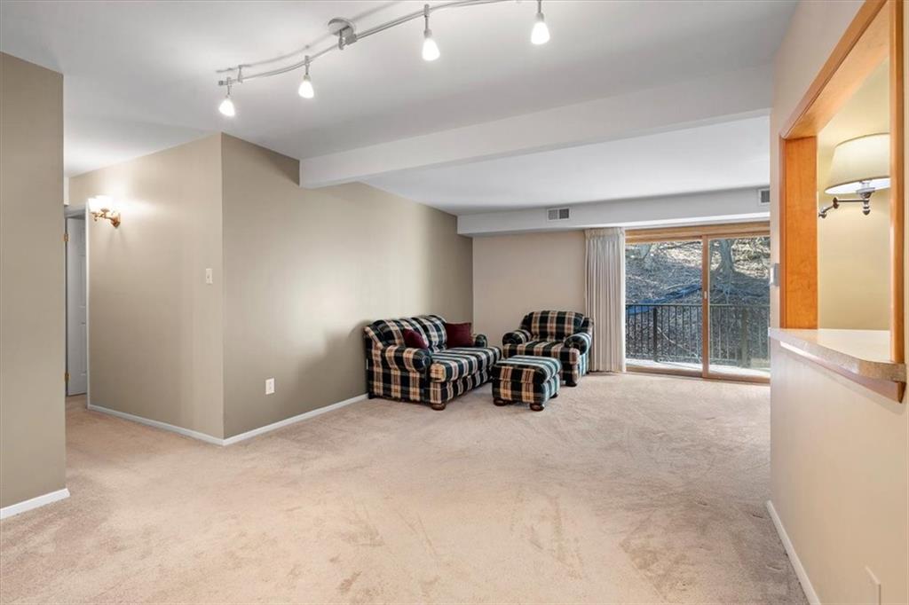 555 Sloop Road, Unit 24 Pittsburgh, PA 15237 - Photo 9 of 34 a view of a room with furniture and a large window