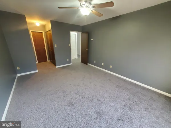 an empty room with a bathroom