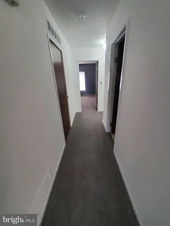 a view of a hallway with staircase