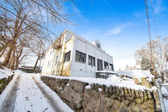 a view of a house with a snow