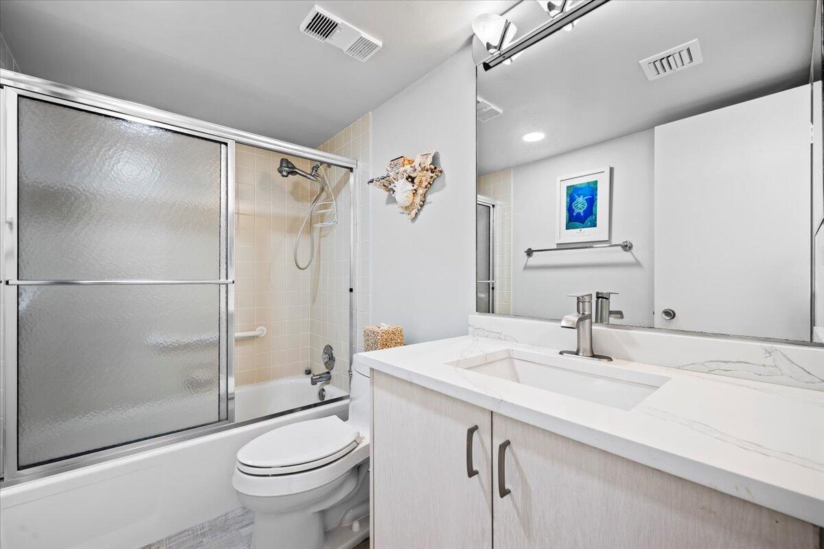 400 Ocean Trail Way, Unit 504 Jupiter, FL 33477 - Photo 14 of 27 a bathroom with a sink toilet and shower