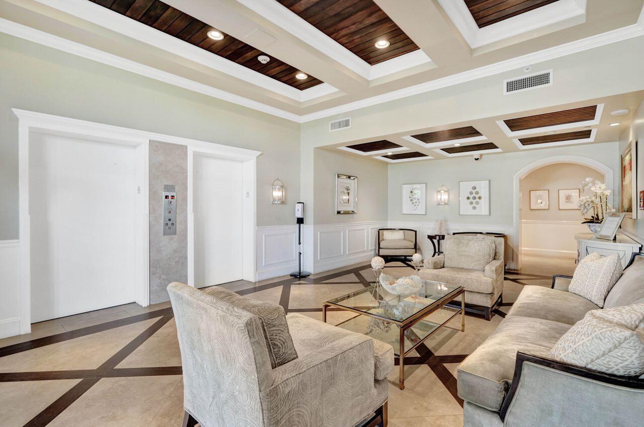 400 Ocean Trail Way, Unit 504 Jupiter, FL 33477 - Photo 16 of 27 a living room with furniture and wooden floor