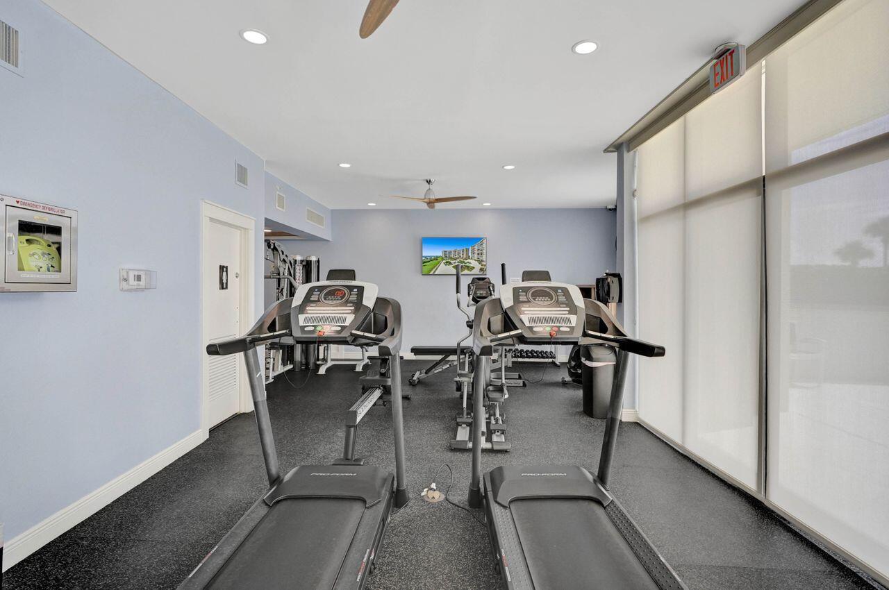 400 Ocean Trail Way, Unit 504 Jupiter, FL 33477 - Photo 17 of 27 a room with lots of chairs and chandelier