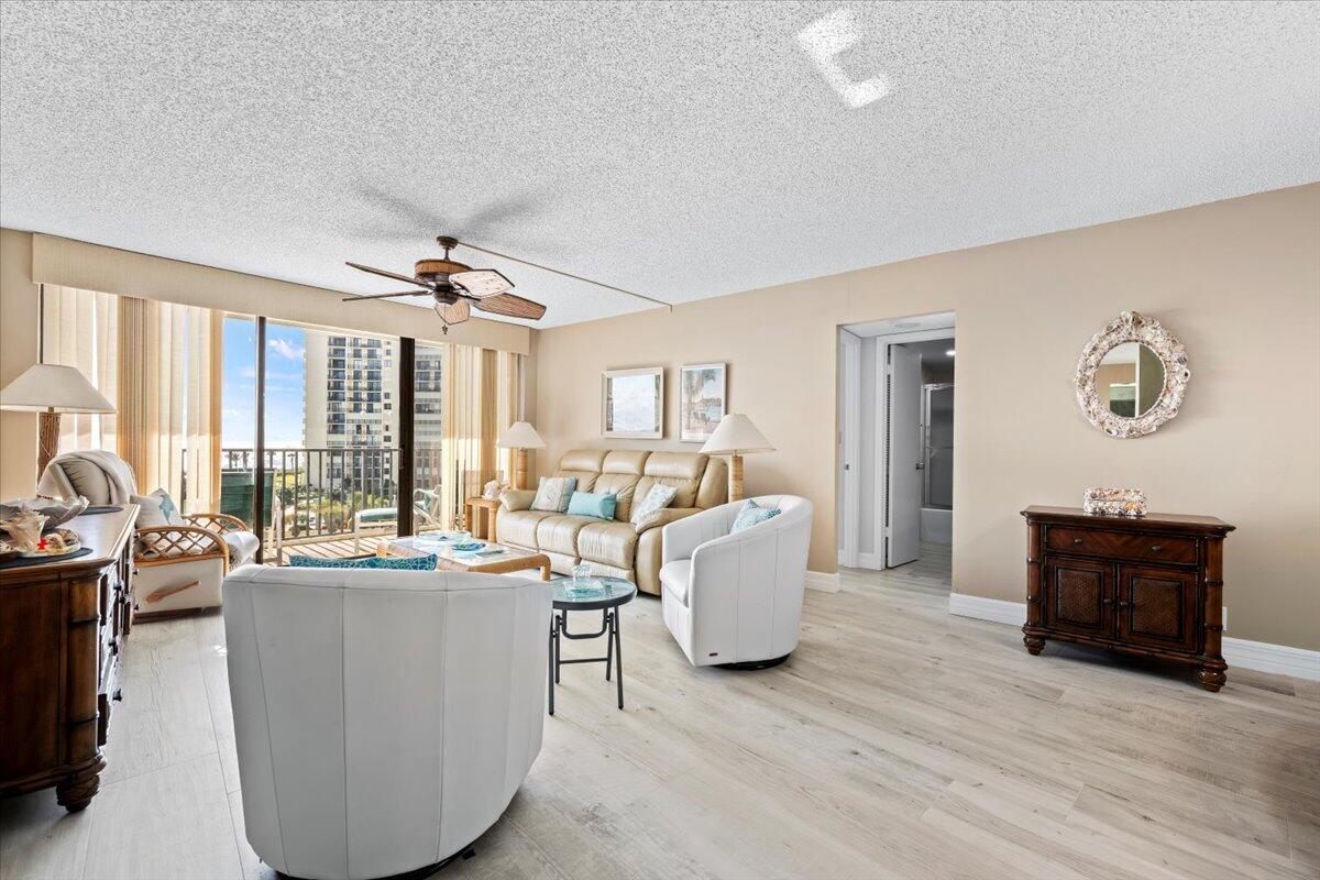 400 Ocean Trail Way, Unit 504 Jupiter, FL 33477 - Photo 3 of 27 a living room with furniture and wooden floor