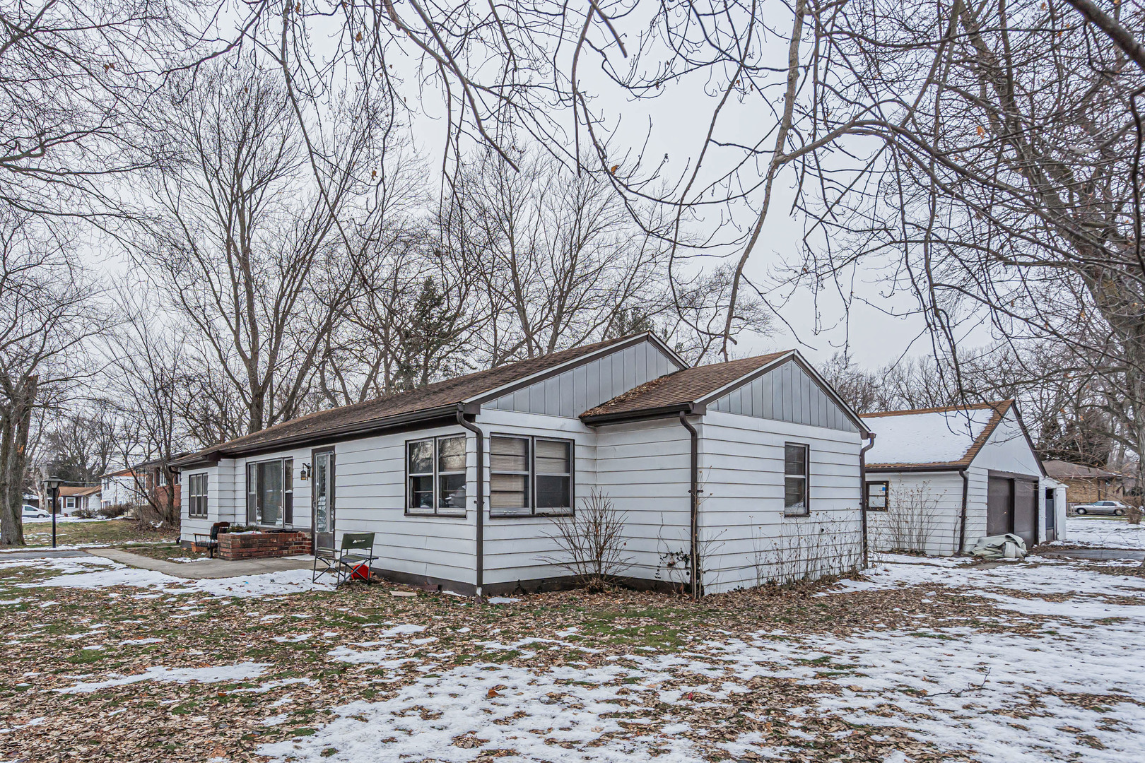 1760 East 158th Street Dolton, IL 60419 - Photo 16 of 22 a view of a house with a yard covered in snow