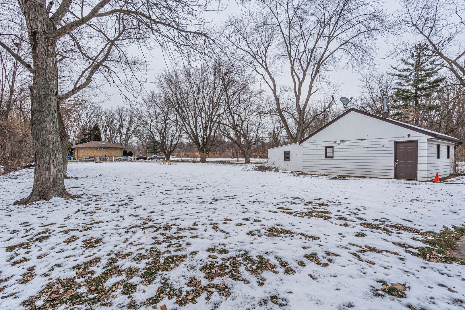 1760 East 158th Street Dolton, IL 60419 - Photo 19 of 22 a view of a yard covered with snow